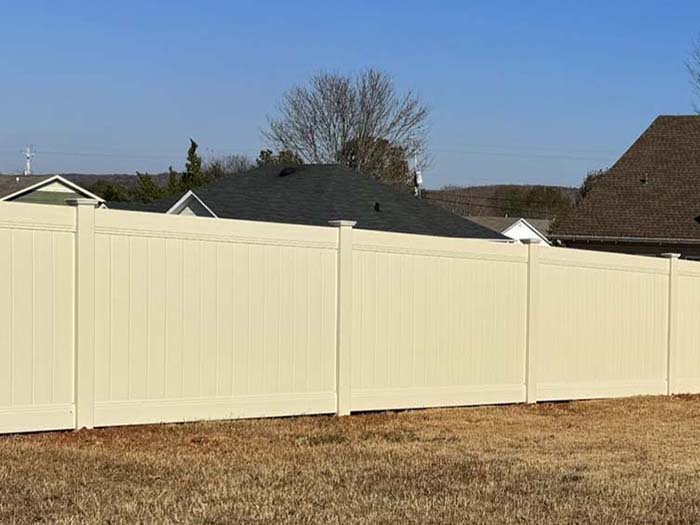 Tan vinyl residential privacy fence in Huntsville Alabama